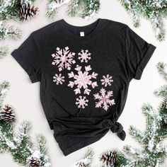 Christmas T-Shirt Snowflake Shirt Cute Christmas Shirt Pink Christmas Shirt Snowflakes TShirt Girly Christmas T-shirts Pink Snowflake Shirt Christmas Gift Shirt Tshirt Christmas Cute Women's Christmas T-shirt  Christmas tshirt with a cute pink snowflake pattern makes the cutest statement this holiday season. Perfect tshirt for a Christmas party or a tshirt for everyday wear during the holiday season! Soft and lightweight, with the right amount of stretch, it's comfortable and flattering for all. Festive Winter T-shirt With Short Sleeves, Festive Short Sleeve T-shirt For Winter, Pink Christmas Shirt, Snowflake Shirt, Pink Snowflake, Girly Christmas, Cute Christmas Shirt, Cute Christmas Shirts, Christmas T Shirts