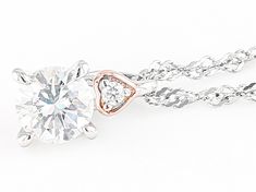 Moissanite Fire(R) .83ctw diamond equivalent weight round, Platineve(R) and 14k rose gold over sterling silver pendant with 18 inch Singapore chain. Measures approximately 7/16" L x 1/4" W. Chain has a spring ring clasp and a 2 inch extender. Actual moissanite weight is .70ctw. Comes with certificate of authenticity. Rose Gold Solitaire Necklace With Diamond Cut Cubic Zirconia, Rose Gold Solitaire Necklace In Cubic Zirconia, Fine Jewelry Rose Gold Solitaire Necklace With Cubic Zirconia, Rose Gold Cubic Zirconia Solitaire Necklace, Anniversary Rose Gold Cubic Zirconia Solitaire Necklace, Rose Gold Solitaire Necklace With Single Cut Cubic Zirconia, Rose Gold Solitaire Pendant Necklace With Diamond Accents, Rose Gold Solitaire Necklace With Diamond Pendant, Dazzling Rose Gold Jewelry With Diamond Accents