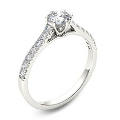 Simply designed with spectacular results, this diamond engagement ring is sure to create a stir. Crafted in cool 14K white gold, this streamlined style features a 1/2 ct. diamond center stone in a six-prong setting atop a cathedral-look shank that sparkles with diamonds. Captivating with 3/4 ct. t.w. of diamonds and a bright polished shine, this engagement ring is certain to dazzle and delight. Peoples Jewellers, Quality Diamonds, 1 Carat, Diamond Clarity, Diamond Stone, Jewelry Store, Diamond Engagement Ring, Prong Setting, Jewelry Stores