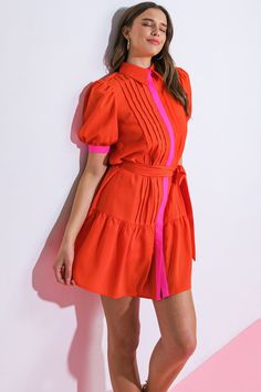 Experience luxury and sophistication in our exquisite READY WHEN YOU ARE WOVEN MINI DRESS. This stunning dress is designed with a shirt collar, hidden button down, short puff sleeves, a self sash tie, and a beautiful ruffled hemline. Elevate your style with this must-have piece that exudes elegance and exclusivity. Details:Self : 95% Polyester 5% SpandexContrast : 95% Polyester 5% SpandexLining : 100% PolyesterSize & Fit- Model is 5`8" And Wearing Size Small- Measurements Taken From Size Small- Fitted Shirt Dress With Puff Sleeves, Fitted Red Shirt Dress For Summer, Chic Short Sleeve Shirt Dress For Party, Summer Party Dress With Collared Neckline, Elegant Pink Collared Mini Dress, Red Mini Length Shirt Dress, Party Short Sleeve Shirt Dress, Chic Red Summer Shirt Dress, Red Short Sleeve Shirt Dress For Work