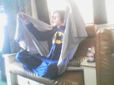 a man sitting in a hammock with the caption imagine watching batman with andy