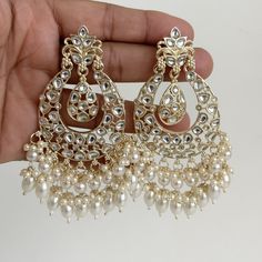 White gold Pearl Kundan chandbali Earrings, White chandbali earrings, Indian pakistani wedding jewelry, bridesmaid gift Indo Western Chand Earring With Gold Plating Product Weight = 25 grams each earring Height = 95 mm || Width = 60 mm Trendy Design Indo Western Earring Arrives in a gift box Color, shades, texture displayed may slightly vary from the actual product due to digital image limitations. We request you to consider these minor variations. Please expect the possibility of some slight imperfections when buying handmade jewelry. If you have any questions, please contact us. Luxury Wedding Chandbali Pearl Earrings, Luxury Fusion Style Chandbalis For Wedding, Luxury Gold Plated Chandbali Chandelier Earrings, Luxury Chandbali Danglers With Latkans, Luxury White Meenakari Bridal Earrings, Luxury Chinon Palazzo Set Chandbali Style, Luxury Pearl Drop Chandbalis For Celebration, Luxury Cutdana Chandbali Pearl Necklace, Luxury Chandbali Jewelry For Celebration