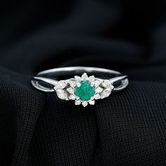 Product Details This elegant Emerald Ring features a stunning Flower Design that is sure to capture your heart. The Round Shape Emerald is set in a Claw Setting and accented with Diamond stones on the Floral Engagement Ring, adding to its perfect beauty. Uniquely adorned, this ring is a timeless piece that will always hold a special place in your heart. Product Information SKU SHP-RINGS0821221661 Width 3.8 mm Height 7 mm Weight 2.00 gm (Approximate) EMERALD INFORMATION No.of Stones 1 Pieces Tota Perfect Beauty, Floral Engagement Ring, Flower Engagement Ring, Claw Setting, Signature Jewelry, Diamond Flower, Timeless Jewelry, Emerald Gemstone, Emerald Ring