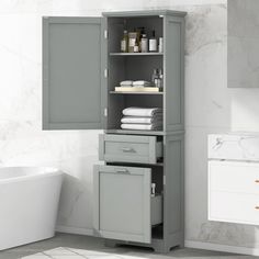 a bathroom with a white bath tub and gray cabinet