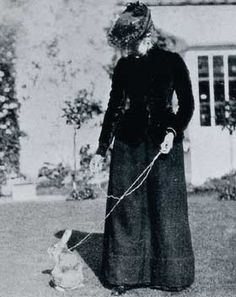 an old black and white photo of a woman holding a dog on a leash with the caption beatix with boygum bunny