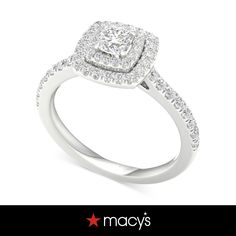 a cushion cut diamond engagement ring with pave set shoulders