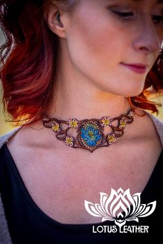 Step into a realm of enchantment with our fae-style natural leather vine and flower choker. Crafted for those who carry the heart of a faery queen, this exquisite piece captures the essence of the cottagecore aesthetic. It's more than a leather choker necklace; it's a handmade emblem of nature's untouched beauty. Perfect for forest wanderings or as a magical accent to your daily look. 🌿✨ Save this piece of the forest for your jewelry collection! #Cottagecore, #HandmadeJewelry, #NatureInspired Artisan Leather Jewelry, Nature-inspired Brown Jewelry For Festivals, Whimsical Adjustable Jewelry For Festivals, Hand Painted Adjustable Jewelry For Festivals, Handmade Fantasy Choker As Gift, Fantasy Style Adjustable Choker Jewelry, Unique Leather Jewelry For Festivals, Unique Hand Tooled Jewelry, Hand Painted Jewelry For Festival