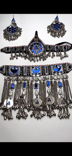 Jewelry set includes Headpiece (maatika) Earrings Choker necklace  color is beautiful royal blue Gorgeous Afghan Jewelry Set Hand Made Afghani Necklace And Earrings Afghani Tribal Choker Necklace Headpiece and Earrings  Afghan Jewellery Authentic Traditional Handmade Jewellery The back of the Matha Pati (Head Piece) has a black cotton cloth for real comfort.   Afghani Jewelry is perfect for completing any outfit. Afghani jewelry will elevate and compliment your outfit by adding a touch of elegan Balochi Jewellery, Afghan Accessories, Afghan Necklace, Afghan Jewelry Head Piece, Afghani Jewelry, Afghan Jewellery, Afghani Necklace, Jewelry Royal, Afghani Jewelry Choker