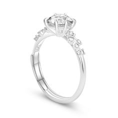 a diamond engagement ring with three stones on the side