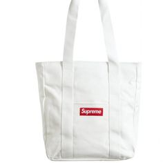 Supreme Canvas Tote Bag White Red New Fw20 Original Plastic Bag Luxury White Canvas Bag With Top Carry Handle, Luxury White Shoulder Bag With Large Capacity, White Luxury Large Capacity Shoulder Bag, Luxury White Large Capacity Shoulder Bag, Luxury Large Capacity White Shoulder Bag, White Luxury Canvas Shopping Bag, Luxury White Canvas Shopping Bag, Luxury White Canvas Bag For Daily Use, Luxury White Rectangular Canvas Bag