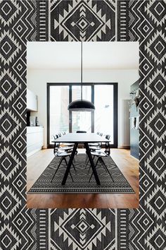 a black and white dining room with an area rug