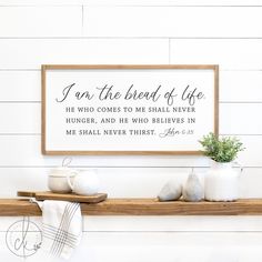 a wooden sign that reads, i am the bread of life he who comes to me shall never