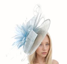 Hats By Cressida Kentucky Derby & Ascot Fascinator Hats Baby Blue Adonis Sinamay & Feather Disc Fascinator Hat Baby blue sinamay swirls trimmed with a mass of baby blue feathers and curled burnt feathers on a large sinamay base The hat base measures about 12 inches wide This baby blue fascinator is mounted with matching headband If you prefer a headband to match your hair, please make a note at check out what colour headband you want. This formal occasion fascinator is perfect for any special event such as a wedding, bridal shower, tea party or ladies luncheon.  This headpiece also is great for a day at the races like the Kentucky Derby, Ladies Day, Royal Ascot, Cheltenham, Goodwood, Dubai Cup, Breeders Bup and Spring Racing Festival.  We make each hat to order just for you, we would prefe Blue Mini Hat For Spring Wedding, Light Blue Headpiece For Royal Ascot Party, Elegant Blue Boater Hat For Spring, Light Blue Headpiece For Kentucky Derby Party, Light Blue Mini Hat For Kentucky Derby Party, Blue Short Brim Boater Hat For Parties, Light Blue Fitted Hat For Weddings, Light Blue Fitted Mini Hat For Weddings, Blue Short Brim Fascinator For Wedding