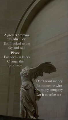 an angel statue in front of a building with a poem written on the wall above it