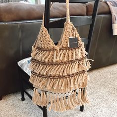 This Gorgeous Hard To Find American And Beyond Jute Crochet Bag Is Brand New With Tags In Perfect Condition. The Quality Of These Bags Is Unmatched. The Tassel Detail, Beading, And Overall Look Is Timeless. You Will Not Be Disappointed In This Bag!! -Handles Are 10” Long -Bag From Bottom Of Actual Bag To Middle Is 13”. From Bottom Tassel To Top Of Handle Is 33” Total. -Widest Part Of Bag Is 17”. Colors Are Brown, Beige, Tan, Taupe. All Neutral Colors. Any Questions Please Let Me Know. Bought Fro Brown Crochet Bag For Beach Season Day Out, Casual Brown Crochet Bag With Fringe, Bohemian Beige Shoulder Bag For Day Out, Brown Fringed Crochet Bag For Summer, Brown Fringed Beach Bag, Brown Fringe Crochet Bag For Summer, Bohemian Brown Beach Bag With Fringe, Beige Crochet Bag With Fringe For Everyday Use, Beige Macrame Bags For Beach Season