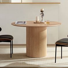 a round wooden table with two chairs around it and a candle holder on the top