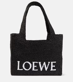 Paula's Ibiza Medium logo raffia tote bag in black - Loewe | Mytheresa Designer Rectangular Straw Bag With Top Carry Handle, Luxury Straw Tote Bag With Rolled Handles, Luxury Straw Tote Bag, Designer Natural Bags With Rolled Handles, Designer Black Rectangular Straw Bag, Designer Black Straw Bag With Top Handle, Top Handle Straw Bag With Dust Bag For Shopping, Designer Straw Bag For Shopping With Top Carry Handle, Designer Everyday Straw Tote Bag