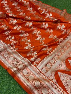 This is a very beautiful high quality mashru silk saree . All over zari motifs design with border . Saree length - 5.5 mtr. Blouse - 1 mtr. Dry clean only . Please note - color may be vary a little due to sunlight and photography . Please message us after purchasing in case you want fall and Pico done it not . No extra charges for fall and Pico but inform us . Blouse stitching is also available . Orange Saree With Zari Weaving Traditional Drape, Orange Saree With Zari Weaving, Orange Katan Silk Lehenga With Traditional Drape, Orange Silk Saree With Pallu, Orange Semi-stitched Banarasi Silk Pre-draped Saree, Orange Katan Silk Saree For Diwali, Designer Dola Silk Orange Saree, Orange Katan Silk Saree With Pallu, Orange Katan Silk Saree With Pallu Detail