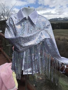 Girls silver/white high shine with   silver sequines fringe added to sleeve .  fringe can go over sleeve cap or underarm. this one has white collar but can be any color, choice of design on collar.   Hand wash, no heat lay flat to dry,   don't leave soak with the fringe all seams are surged  I can add fringe to all shirts for an extra 25$,  this one comes with it but can order just the shirt too.    I have several color of fringe, not all are sequines GIRLS  LARGE--MEASURMENTS BELOW      MEASURE Western Pleasure Shirt, Western Show Shirts, Fringe Shirt, Arm Pits, Western Pleasure, Cowgirl Shirts, Don't Leave, The Fringe, You Know It