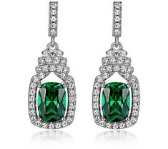 Add an elegant sparkle to the occasion by donning these lustrous earrings that each showcase a large green Diamonique simulated diamond. Green Diamond Earrings For Formal Occasions, Classic Green Diamond Drop Earrings, Green Diamond Drop Earrings, Green Diamond Earrings For Evening, Green Cubic Zirconia Party Earrings, Green Cubic Zirconia Crystal Earrings For Party, Green Cubic Zirconia Diamond Drop Earrings, Elegant Green Crystal Earrings For Pierced Ears, Green Crystal Earrings For Pierced Ears