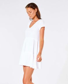 The Premium Surf Dress will be a staple piece for your collection this summer. Perfect to throw over bikinis or to dress up for a night out. Made in a relaxed fit and finished with shirring detail. Features: 100% cotton, Relaxed fit, Inner neck label, Metal logo trim, Shirring detail Model Wears Model is 176 cm (5'8) and wearing a size XS. Relaxed Fit V-neck Mini Dress For Summer, Summer V-neck Mini Dress With Relaxed Fit, Relaxed Fit V-neck Mini Dress For Vacation, Breezy Short Sleeve Mini Dress, Casual Mini Dress For Poolside Summer, Relaxed Fit Summer Dress, Beachy Beach Dress With Short Sleeves, Chic Relaxed Fit Mini Dress For Vacation, Relaxed V-neck Beach Dress For Day Out