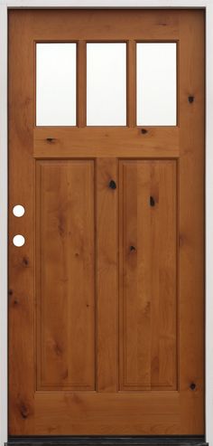 a wooden door with three glass panels