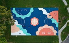 an aerial view of a basketball court in the park