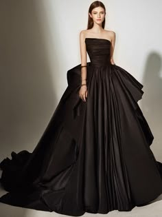 This Classic Gothic Black Strapless Wedding Dress Plus Size is perfect for your big day. This dramatic dress features a strapless silhouette with a sweetheart neckline and a corset bodice for an elegant look. The skirt is full and gathered for a beautiful and timeless look. The black fabric is adorned with delicate lace appliques for a romantic and classic look. The intricate detailing throughout this dress is sure to make you shine on your special day. Details:sleeveless, strapless, open ... Polka Dot Wedding Dress, Dramatic Dress, Black Lace Wedding, Dramatic Dresses, Wedding Dress Plus Size, Strapless Dresses, Black Strapless Dress, Corset Bodice, Wedding Gowns Lace