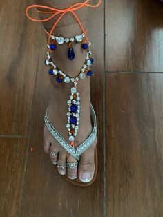 2 Gators blue and orange barefoot sandals made with orange Adjustable Blue Barefoot Sandals For Summer, Adjustable Ankle Strap Orange Sandals, Adjustable Ankle Strap Sandals In Orange, Blue Open Toe Barefoot Sandals For The Beach, Adjustable Orange Sandals For Vacation, Blue Open Toe Barefoot Sandals For Vacation, Orange Sandals For Spring Festival, Blue Ankle Strap Sandals With Adjustable Fit, Adjustable Ankle Strap Blue Sandals