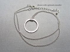 "This classic circle necklace is the perfect gift to show unending love for sisters, moms, bridesmaids, spouse or friends. The 3/4\" hammered circle pendant is created with argentium sterling silver wire and flame. Hammering creates tiny facets that really shine. It is hung from a sterling silver rollo chain. Ends are finished with a lobster clasp closure. Just add to your cart for checkout, & it will arrive in a ribbon tied box ready for gift giving! New! Choose to add a 2\" extender (in dr Unending Love, Eternity Necklace, Simple Classic Style, Karma Necklace, Hammered Ring, Hammered Rings, Silver Circle, Chain Extenders, Ring Pendant