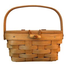 a wooden basket that is sitting on a white surface