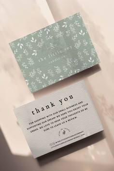 two business cards with the words thank you on them