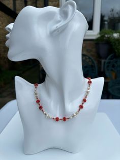 A 9 carat gold red carol bead and pearl necklace with full imported UK hallmark London 1967. This elegant necklace is 45cm long and made of red coral beads, seed pearls, pearls and 9 carat gold beads. The closure ring has the full imported UK hallmark.  VR for Sponsor Mark. 375 for 9 carat gold and the mark of London Imported Article mark after it. The year letter M shows it was made and imported from Continental Europe in 1967/8. This stunning necklace is in perfect condition considering its age. Please check the photos and video to appreciate its full beauty. Vintage Red Jewelry For Holidays, Red Pearl Necklace Gift, Red Vintage Jewelry For Holidays, Elegant Beaded Christmas Necklaces, Elegant Christmas Beaded Necklaces, Red Vintage Holiday Jewelry, Classic Red Beaded Jewelry, Gift Red Pearl Necklace With Polished Beads, Red Pearl Necklace With Polished Beads As A Gift