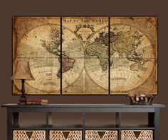 an old world map is displayed on the wall above a table with wicker baskets