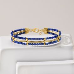 Ross-Simons - Lapis Bead, Snake-Chain Bracelet in 18kt Gold Over Sterling. 7". Offering a regal look, our three-strand bracelet features a gleaming 18kt yellow gold over sterling silver snake chain nestled between two rows of 3mm round faceted lapis beads. Includes a 1" extender. Natural pyrite flecks in lapis will vary. Lobster clasp, lapis bead snake-chain bracelet. Luxury Beaded Yellow Gold Bracelets, Adjustable Elegant Lapis Lazuli Bracelets, Hand-strung Gold Lapis Lazuli Bracelets, Gold Beaded Lapis Lazuli Bracelets, Gold Lapis Lazuli Bracelet With Gemstone, Luxury Gold Bracelets With Gemstone Beads, Luxury Gold Beaded Bracelets With Gemstones, Luxury Gold Beaded Bracelet With Gemstones, Gold Lapis Lazuli Spiritual Bracelets