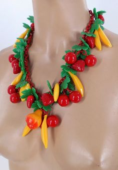 "Offered for sale is this fabulous OOAK, festooned garland fruit necklace measuring 20\" from end clasp to end clasp designed and created by ANKA. The creator used a red celluloid chain and early 1940's mold injected plastics forming green leaves, red cherries, red strawberries, yellow bananas, and a singular pear. The result is a very whimsical and festive design suitable for any season, but most especially summertime. The piece had been designed in the early 1990's and is in excellent vintage Bright Jewelry, Fruit Necklace, Bakelite Jewelry, Fruit Jewelry, Chunky Necklaces, Vintage Inspired Jewelry, Food Jewelry, Red Strawberry, Dope Jewelry