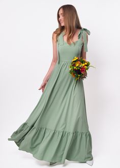 Sage green long dress, bridesmaid dress, wedding guest dress, vintage dress, cocktail dress, maxi handmade dress, summer boho dress This ruffle dress is made of charming delicate fabric which offers a second-skin feeling texture. Whether you're petite, curvy, straight or tall, a wrap flatters almost every figure.  The sizing forgives plus-minus one-two size. You can find the pictures of ALL OTHER COLORS in our catalog on ETSY here: https://www.etsy.com/shop/ENMEstyle?ref=seller-platform-mcnav&section_id=31130333     ADJUSTMENTS  We can make any length adjustments special for you and for free! Model's height is 5'9" (175 cm) / Size US 6 / M Adjustable - Shoulder ties - Elastic back  Details - Long dress Material - Rayon, polyester, elastane - Our fabric is incredibly soft and falls beautifu Long Dress Bridesmaid, Long Green Dress, Plus And Minus, Boho Summer Dresses, Boho Summer, Handmade Dresses, Ruffle Dress, Skirt Length, Dress Materials