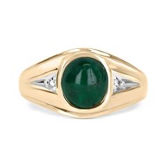 A beautiful three-stone, natural emerald cabochon, and diamond ring. The center stone cabochon has a full 3.16-carats, with a dark green color and very good luster. Accenting the cabochon are two petite brilliant round diamonds. This one-of-a-kind ring is in 10K yellow gold, with a satin finish going halfway down the band giving it the perfect touch. Setting Style: Three-Stone Setting Material: 10K Yellow Gold Gold Weight: 4.4 Grams Main Stone: Emerald Cabochon Shape: Oval Cut Weight: 3.16-Carat Luxury Men's Oval Cabochon Engagement Ring, Classic Round Cabochon Gemstones, Emerald Bezel Set Oval Cabochon Ring, Classic White Gold Cabochons For Anniversary, Classic Oval Cabochons For Anniversary, Oval Signet Ring With May Birthstone Gemstone, Emerald Oval Cabochon Gemstone Rings, Formal Oval Emerald Ring With Gemstone Accents, Classic Cabochon Emerald Ring