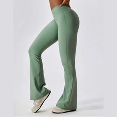 Discover the perfect fusion of style and functionality with these women's high waist flared activewear pants. The high waist design provides excellent tummy control and support, while the elastic waistband ensures a snug yet comfortable fit. The stretchable fabric allows unrestricted movement, making these pants ideal for a range of activities from yoga to dance classes. The flared bottom adds a trendy flair to your gym gear. Stay comfortable, confident, and chic in these versatile activewear pa High Stretch Mid-rise Elastane Pants, High Stretch Elastane Mid-rise Pants, High Waist Yoga Pants With 4-way Stretch For Spring, High Stretch Elastane Flare Activewear, Solid Flare High-stretch Leggings, Solid Color High Stretch Flare Leggings, Solid Flare High Stretch Leggings, Solid Color Flare Leggings With High Stretch, Casual Flared Activewear For Yoga