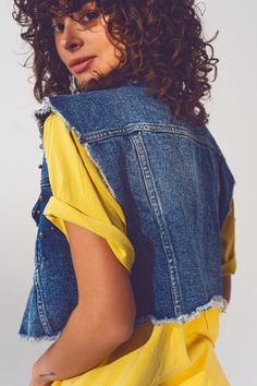 Edgy and stylish, our Cropped Studded Denim Vest in Blue is a must-have for the fashion-forward individual. Crafted with 100% cotton, this vest features a standard fit that runs true to size, modelled by our petite model with measurements 31-22-34 and a height of 5 feet, wearing a size S. The design is elevated by the studded embellishments that add a unique touch to the classic denim vest. The cropped length, frayed ends, and chest pockets combine fashion with functionality. The vest is finishe Tan Scarf, Studded Denim, Jeans Cropped, Sleeveless Vest, Polo Collar, Denim Vest, Fast Fashion, Belted Dress, Fashion Details