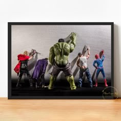 an image of a group of action figures on a shelf in front of a wall