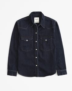 On-trend shirt in a soft denim fabric and relaxed-fit silhouette, with classic collar, chest pockets with snap closure, snap-up front and curved hem. Western Denim Shirt, Womens Denim Shirt, American Clothing, Suits Coats, Athletic Fits, New Arrival Dress, Swimwear Accessories, Shirt Women, Denim Fabric