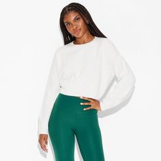 Standard-fit pullover sweater in a solid color from Wild Fable™. Designed with a cropped silhouette. Made from recycled polyester-nylon blend jersey fabric with added spandex. Features a crewneck style with ribbed sleeves. If you're not satisfied with any Target Owned Brand item, return it within one year with a receipt for an exchange or a refund. Wild Fable™: A look for every story. White Long Sleeve Cropped Sporty Sweater, Fitted White Cropped Sweater With Ribbed Cuffs, White Cropped Sweatshirt For Winter, Sporty Cropped Sweater With Ribbed Waistband, White Stretch Sporty Sweater, Sporty Stretch Sweatshirt, Stretch Sporty Sweatshirt, Versatile Stretch Sweatshirt For Fall, White Cropped Relaxed Fit Sweatshirt