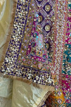 This Multicolor Heavy Embroidered Handwork Pakistani Silk Dupatta with Lining is a stunning piece with intricate handwork of sequins and pearls, a gold lined back and vibrant multi-color block print. Its 2.5 meter size makes it perfect to pair with a Lehenga or Salwar Suit. Stunning and unique, this item is ready to ship from California. Material: Silk Color: Multicolor Pattern: Floral, Block Screen Print Work: Handcrafted sequins, beads, embroidery & pearl work Size: 2.5 meter Condition: New Occasion: Festive, wedding, party Care: Dry Clean Handcrafted productsProduct Note:​ Handcrafted product from artisans and producer groups and due to the nature of the product, slight variation in colors or design may occur. Any slight irregularities are distinctive and are inherent to the beauty of t Eid Embellished Multicolor Embroidered Sets, Eid Embellished Multicolor Embroidery Sets, Embellished Multicolor Embroidery Sets For Eid, Festive Embellished Multicolor Embroidered Set, Diwali Embellished Multicolor Embroidery Sets, Traditional Embellished Set With Multicolor Embroidery, Bohemian Sequined Sets With Traditional Drape, Bollywood Style Embellished Multicolor Embroidery Sets, Festive Embellished Traditional Wear With Multicolor Embroidery