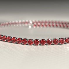 Get ready to make a stylish statement this Thanksgiving with our Red Garnet Tennis Bracelet in 14K/18K Solid Gold. Perfect for stacking or wearing alone, this custom bracelet features the vibrant January birthstone. Handmade with love, this personalized piece makes for a unique and thoughtful Thanksgiving gift.𝐅𝐞𝐚𝐭𝐮𝐫𝐞𝐬:• 𝐌𝐚𝐝𝐞 𝐭𝐨 𝐎𝐫𝐝𝐞𝐫• 𝐌𝐞𝐭𝐚𝐥: 𝟏𝟒𝐊 | 𝟏𝟖𝐊• 𝐁𝐚𝐧𝐝 𝐂𝐨𝐥𝐨𝐫𝐬: Rose Gold, Yellow Gold & White Gold• 𝐂𝐮𝐬𝐭𝐨𝐦 𝐂𝐫𝐨𝐜𝐨𝐝𝐢𝐥𝐞 𝐋𝐨𝐜𝐤𝐒𝐭𝐨𝐧𝐞:• ? Elegant Red Round Bracelets, Elegant Red Round Crystal Bracelet, Red Round Tennis Bracelet For Formal Occasions, Elegant Red Tennis Bracelet For Anniversary, Red Jubilee Bracelets For Parties, Red Jubilee Bracelet For Party, Red Diamond Bangle Bracelet Gift, Red Ruby Diamond Bracelet Gift, Elegant Red Crystal Bangle Bracelet