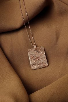 Large rose gold pendant necklace, Big square pendant large Square medallion necklace, Rectangular necklace Chunky pendant, Charm necklace  Charm necklace with a textured rectangle pendant. The pendant has a sculptural look - the making process results every time with a different pattern so every pendant is unique.  Size XL For other sizes/models/complete sets explore further in the section "Minimal necklaces" in our shop: https://www.etsy.com/shop/MairBerlin?ref=seller-platform-mcnav&section_id= Luxury Necklace With Large Square Pendant, Luxury Necklace With Large Pendant For Gift, Luxury Rose Gold Square Pendant Jewelry, Cheap Rectangular Pendant Necklaces For Women, Luxury Handmade Necklace With Square Pendant, Cheap Metal Necklace With Rectangular Pendant, Cheap Gold Charm Necklace With Square Pendant, Luxury Square Pendant Necklace With Bezel Setting, Luxury Brass Jewelry With Rectangular Pendant