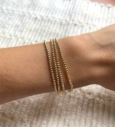 The Mini Bead Bracelet has 14K Gold Filled 2mm beads. This beautiful bracelet is beautiful for that minimalist look but also the perfect bracelet to add to your growing stack.  This bracelet has a little bit of stretch.  Please make sure to measure your wrist at the widest part so you know your size. Dainty Hypoallergenic Stretch Bracelet For Everyday, Minimalist Hand-strung Beaded Bracelets In 14k Gold Filled, Minimalist Hand-strung 14k Gold Filled Beaded Bracelets, Dainty Round Stretch Bracelet For Everyday, Dainty Everyday Stretch Bracelet, Everyday Dainty Stretch Bracelet, Delicate Stackable Beaded Bracelets For Everyday, Delicate Stackable Everyday Beaded Bracelets, Minimalist Stackable Stretch Bracelet For Everyday