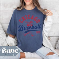 ⚾ Get Game Day Ready with this Chicago Baseball tee! ⚾ SIZING: Follow the size chart in the photos to determine fit for a regular fit or an oversized look! DETAILS: Comfort Colors will be your new favorite tee!! If you're looking for a thick, structured tee that's also super soft and breathable--look no further! This garment-dyed heavyweight t-shirt ticks all the boxes and is made of 100% ring-spun cotton. This tee is both trendy and stylish! Perfect Game Day outfit whether you are cheering in the stands or enjoying the game at home! ✨100% ring-spun cotton ✨Relaxed fit MADE TO ORDER: Please note that this shirt is made especially for you as soon as you place an order. While it may take a bit longer to deliver, know that by producing items on demand rather than in bulk, we are reducing over Cotton T-shirt With Baseball Season Lettering, Everyday Short Sleeve Tops With Lettering, Baseball Season Crew Neck Screen Print Top, Crew Neck Screen Print Top For Baseball Season, Graphic Tee With Text Print For Baseball Season, Text Print Crew Neck Tops For Baseball Season, Crew Neck Graphic Tee With Lettering, Vintage Short Sleeve Tops For Baseball Season, Graphic Tee Crew Neck Tops For Baseball Season