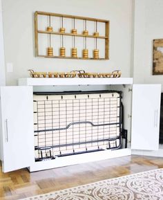 a living room with white furniture and wooden floors