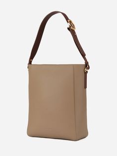 The Carrie Medium Tote Bag's rectangular silhouette sits perfectly on the shoulder, with a wide leather strap that is adjustable with the belt loop detail. Lined with smooth leather, the bag can fit an 13" laptop, making it an ideal everyday tote. Optional Add-ons: Webbing Shoulder Strap; AirPods Pro Case. Everyday Tote, Medium Tote, New Green, How To Make Shorts, Day Bag, Small Purse, Leather Interior, Perfect Bag, Hobo Bag